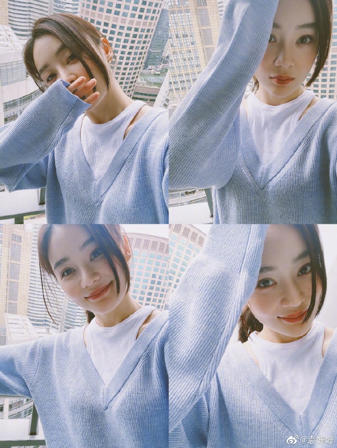 袁姗姗穿蓝色毛衣元气十足 倚靠阳台温柔恬静