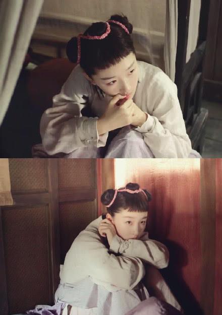 周冬雨的齐刘海，搭配上一袭暗灰色的衣裳，再加上这个惊恐的小表情，有点像是村头的小“二妞”！