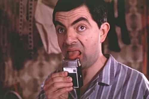 查理·卓别林,肥裤子,破礼帽,小胡子,大头鞋,再加上一根从来都不舍得