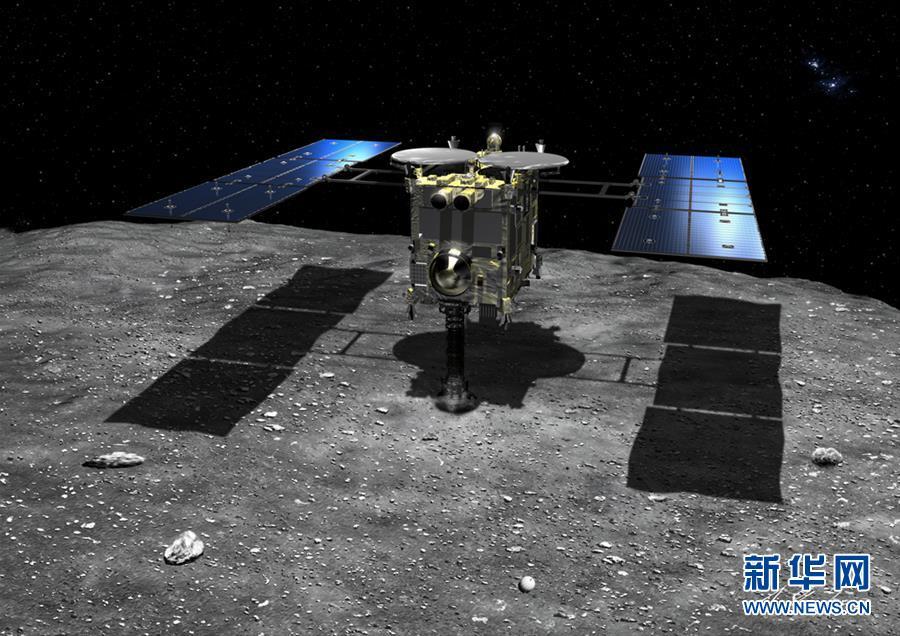 这是隼鸟2号探测器降落在小行星“龙宫”的模拟图。 新华社发(日本宇宙航空研究开发机构供图)