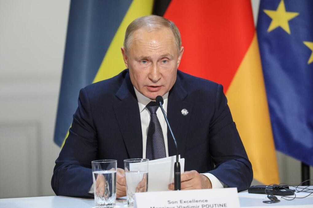 (普京在巴黎，图源：路透社)